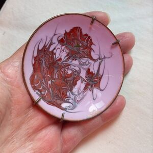 Small decorative enamel plate on copper